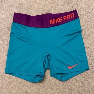 Nike Pro Teal Shorts with Purple Waistband